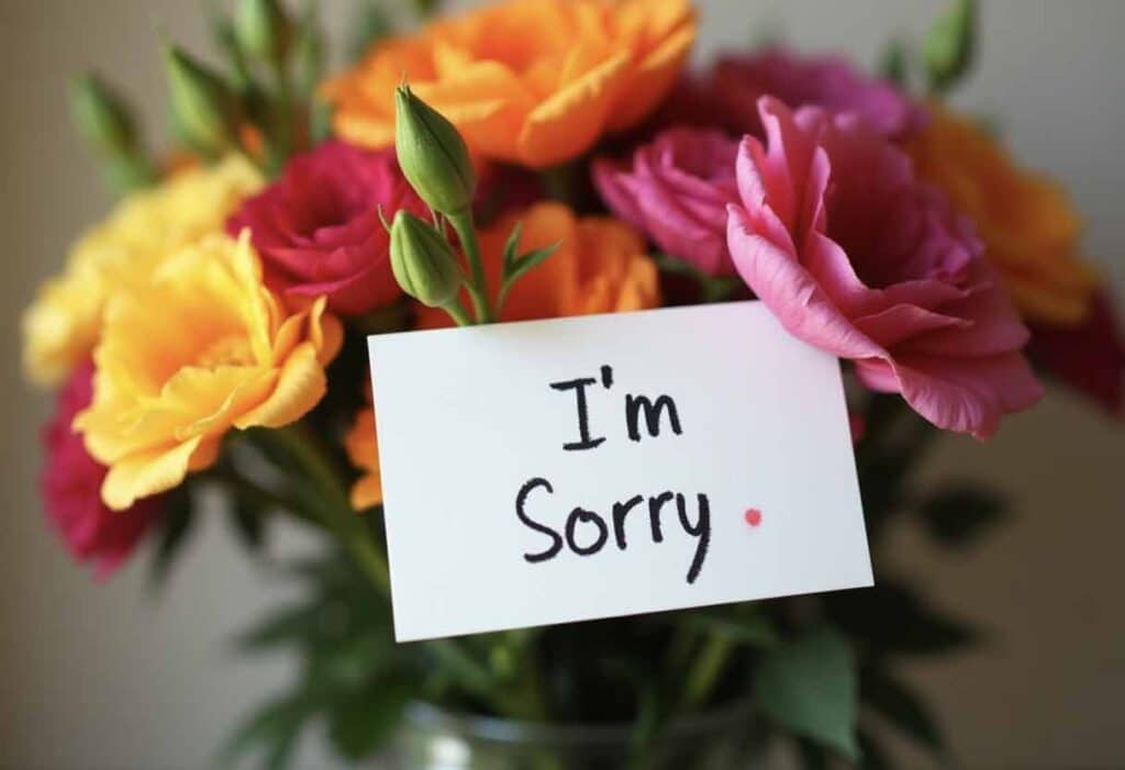 A colorful bouquet with a handwritten note that says, "I’m Sorry."
