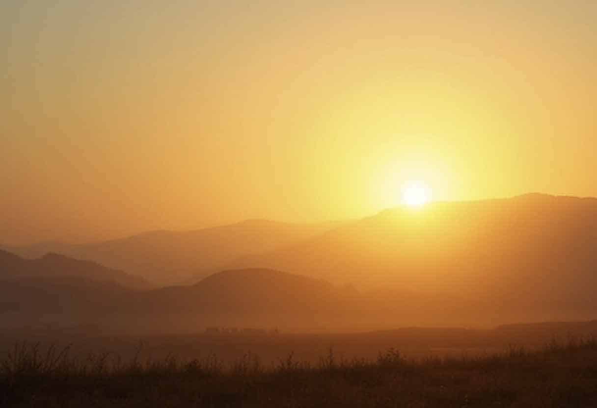 Peaceful sunrise over a quiet landscape, symbolizing new beginnings.
