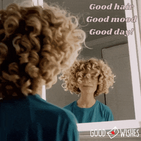 good hair day - curly woman looking at a mirror - animated gif